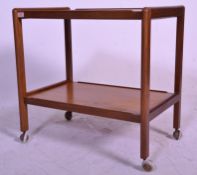 A retro mid 20th Century teak wood two tier tea trolley of rectangular form having rounded ends.