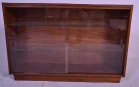A 1960's retro vintage teak wood glass display cabinet having twin glass sliding doors and two glass
