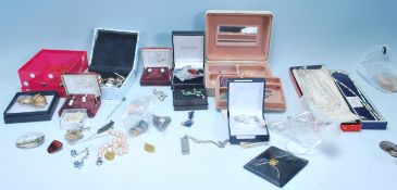 A collection of vintage 20th Century fashion / costume jewellery to include a silver pendant set