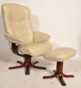 A contemporary Stressless style white leather armchair with matching footstool. Both being raised on