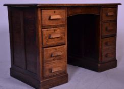 A 1920's oak twin pedestal office desk. Raised on plinth bases to each pedestal having a bank of