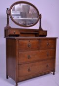 A early 20th Century 1920's Art Deco oak dressing table chest of drawers having an oval swing