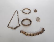 A collection of vintage silver jewellery to include two hinge opening bangles with engraved