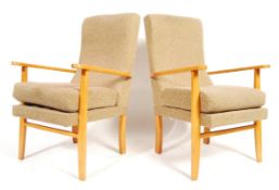 A pair of late 20th Century beech wood easy lounge chair / armchairs having a shaped woollen