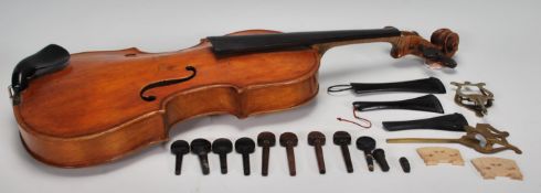 An early 20th century antique violin size 4/4 possible German, having walnut back, F-holes pierced
