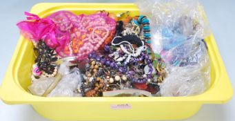 A large collection of costume jewellery to include a selection of beaded necklaces including faux