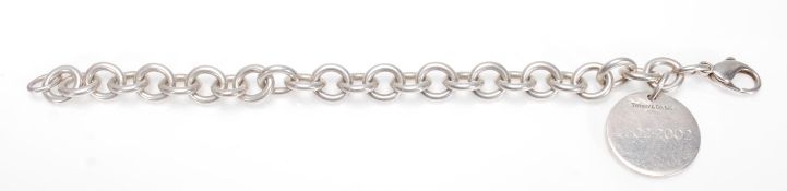 A 925 silver Tiffany & Co pendant and bracelet chain of curb link form united with lobster clasp.