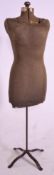 A vintage 20th Century shops display mannequin / tailors dummy, the body upholstered in brown fabric