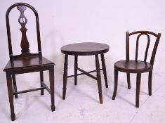 A 19th century oak childs chair of folk design being raised on squared legs with panel seat and