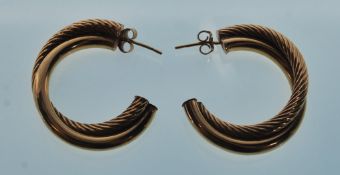 A pair of 9ct yellow gold hoop earrings having a double hoop with one smooth and another with reeded
