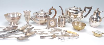 A collection of silver plated wares to include an early 20th century silver mounted alarm clock with
