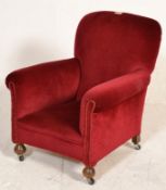 A 20th Century child's small bedroom armchair raised on turned wooden feet with castors below,