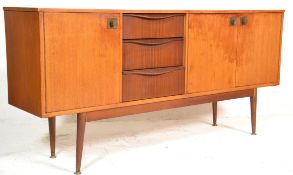 A vintage retro 20th Century teak wood sideboard credenza having an offset central bank of three
