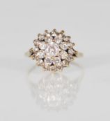 An English hallmarked 9ct yellow gold antique style ladies cluster ring set with a central round