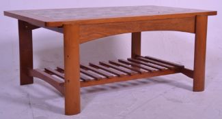 A vintage retro 20th Century teak wood tile top coffee table having a sectional retro print flower