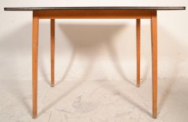 A vintage mid 20th Century formica dining table having a red patterned top raised on tapering wooden
