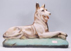 An early 20th century / 1930's Art Deco  fairground prize in chalkware depicting and Alsatian dog