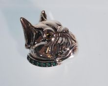 A silver brooch in the form of a face of a Bulldog. Sterling silver. The eyes are set with rubies