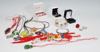 A collection of vintage costume jewellery to include a pair of silver pandora earrings, two