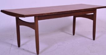 A good retro mid 20th Century Danish inspired teak wood coffee table of rectangular form raised on