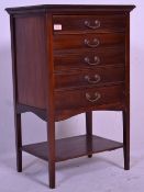 An Edwardian mahogany pedestal music cabinet. Rais