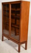 An I. Nissenbaum & Sons 1960's retro vintage teak wood glass display cabinet having twin glazed