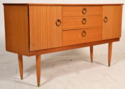 A 20th Century Schreiber retro vintage sideboard credenza having a central bank of three drawers