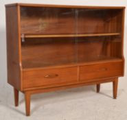 A mid century Jentique retro vintage teak wood glass display cabinet having a twin glazed sliding