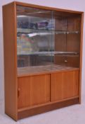 A vintage retro mid 20th Century teak wood display drinks cabinet / bookshelf having two glass