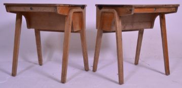 A pair of vintage / retro mid 20th Century school desks, plank top with lift up flap to rear with