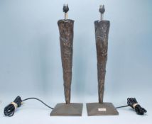 A good pair of Art Deco style tall bronze effect table lamps. Each of tapering form being raised