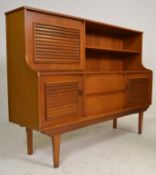 A good retro mid 20th Century teak wood highboard / sideboard credenza having a concave front with