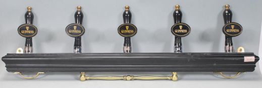 A set of five advertising / display Guinness tap / handle beer pumps finished in black with each