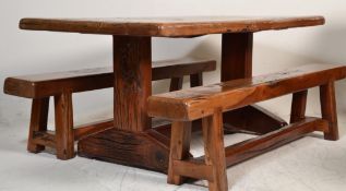 A large contemporary African hardwood dining table and benches. The benches raised on straight leg