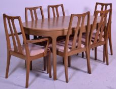 A retro 20th Century teak wood extendable dining table and matching chairs by Nathan. The oval table
