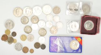 A collection of coins to include three 1999 £5 coi