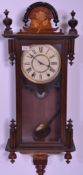 An early 20th century mahogany cased Vienna regulator wall clock complete with pendulum and