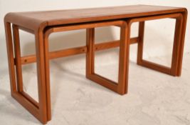 A 20th Century O'Donnell retro vintage teak wood nest of tables having a long coffee table with