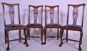 A set of four Edwardian mahogany Queen Anne style high back dining chairs raised on cabriole legs