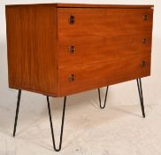 A stunning Danish retro vintage teak wood chest having a bank of three drawers each with two round