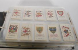 An album of vintage Wills's Cigarette trade cards in full sets. The wills sets include Arms Of The