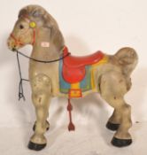 A vintage retro mid 20th Century 1950's toy ride along horse complete with blue and red coloured