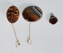 A group of 19th Century Victorian brooches to include a banded agate brooch of oval form, a carved