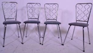 A set of 4 mid century retro chrome tubular metal dining chairs. Raised on chrome frames with