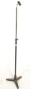 A vintage 20th Century adjustable mic stand in the