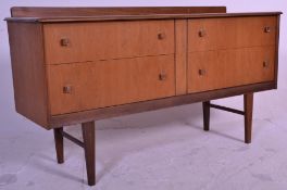 A good retro mid 20th Century teak wood sideboard credenza having a flared top above four drawers