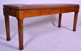 A late 19th century Victorian doctors medical couch. Raised on  thick turned legs rising to the long