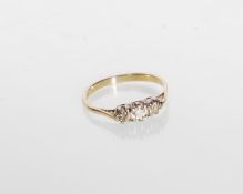 A hallmarked 9ct gold ladies ring set with three round cut white stones. Hallmarked Birmingham 2001.