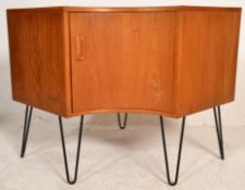 A Vinctor B. Wilkins G-Plan Fresco range 1960's teak wood corner cupboard raised on hairpin legs.