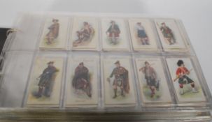 An album of vintage John Players cigarette trade cards. Full sets include Highland Clans, Speedway